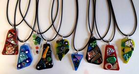 Dichroic glass pendants are made to match any outfit